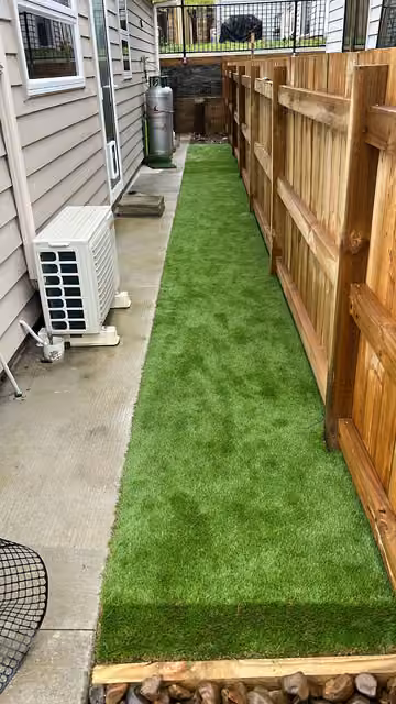 Artificial grass laid in a narrow side yard