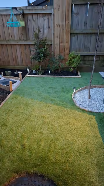 Customer photo of newly planted garden beds around a courtyard