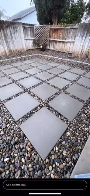 Square paving stones set into garden gravel